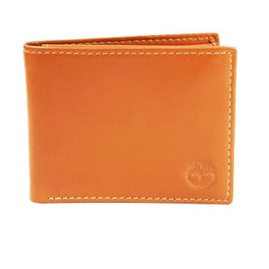 Studio product photograph of the Timberland mirror original wheat tan smooth leather bifold wallet highlighting the round silver metal tree hardware logo corner accent