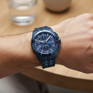 Close up macro view of the navy blue textured dial and silver markers of Tommy Hilfiger 1710622