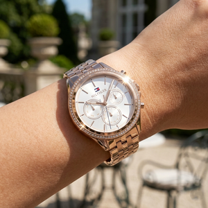 Close up shot of Tommy Hilfiger 1781978 on wrist showing the off-white dial and sparkling crystal bezel details in rose gold