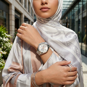 Woman wearing Tommy Hilfiger Kennedy silver stainless steel watch for a glamorous and professional daily look