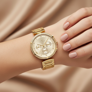 Close up shot of Tommy Hilfiger 1782392 watch on wrist showing the sparkling gold sunray dial