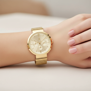 Close up shot of Tommy Hilfiger 1782539 watch on wrist showing the radiant gold sunray dial