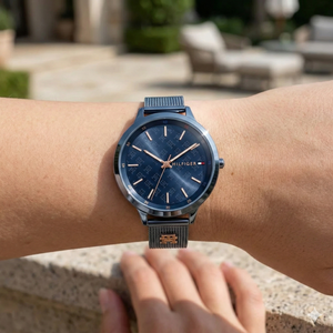 Close up shot of Tommy Hilfiger 1782589 on wrist showing the intricate TH monogram dial pattern and rose gold hands