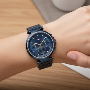 Close up shot of Tommy Hilfiger 1782704 watch on wrist showing the blue dial and sparkling crystal bezel