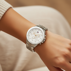 Close up macro view of the white dial with crystal markers and gold accents of Tommy Hilfiger 1782707