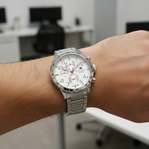 Close up shot of Tommy Hilfiger 1791140 on wrist showing the crisp white dial with multi-function sub-dials and bold numerals