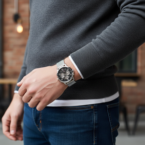 Male model wearing Tommy Hilfiger 1791292 silver mesh watch with a casual black outfit