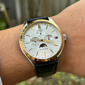 Close up shot of Tommy Hilfiger 1791305 watch on wrist showing the moonphase subdial