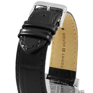 Left side perspective of the silver case and detailed stitching on the black leather strap of the Tommy Hilfiger watch