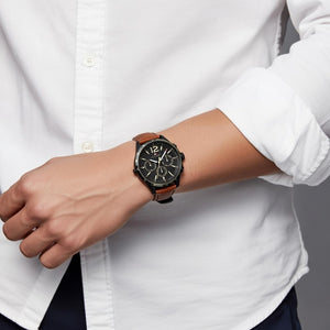 Male model wearing Tommy Hilfiger 1791470 black watch with a casual outfit