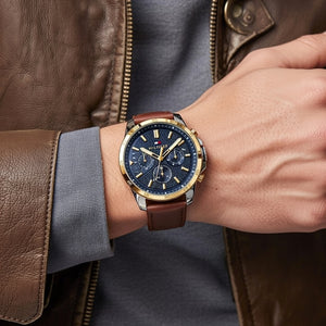 Male model wearing Tommy Hilfiger 1791561 two-tone watch with a casual outfit