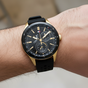 Close up shot of Tommy Hilfiger 1791636 watch on wrist showing the black sporty dial