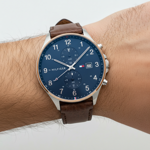 Detailed shot of Tommy Hilfiger 1791712 watch on wrist showing blue sunray dial