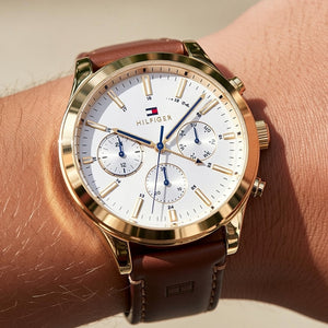 Close up shot of Tommy Hilfiger 1791742 watch on wrist showing the white multifunction dial details