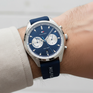 Close up shot of Tommy Hilfiger 1791781 watch on wrist showing the blue dual time sub-dials