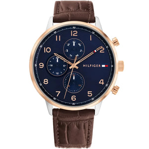Close up shot of Tommy Hilfiger 1791798 watch on wrist showing the black multifunction dial