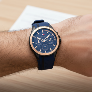 Close up shot of Tommy Hilfiger 1791860 on wrist showing the navy blue dial with multi-function sub-dials and gold-tone hands