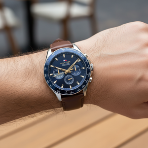 Close up shot of Tommy Hilfiger 1791965 on wrist showing the blue dial with multi-function sub-dials and gold-tone hands