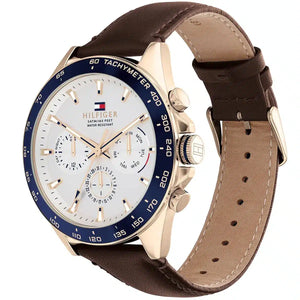Angled view of Tommy Hilfiger 1791966 highlighting the polished gold-tone case and premium brown leather strap