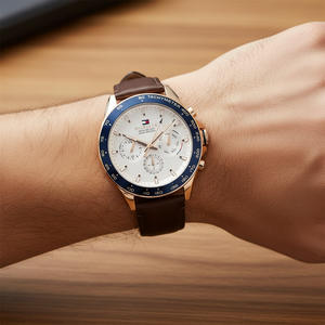 Close up shot of Tommy Hilfiger 1791966 on wrist showing the white dial with multi-function sub-dials and gold-tone hands