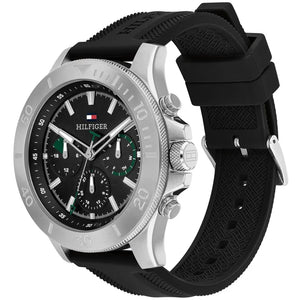 Tommy Hilfiger Bryan 1792111 men's watch with silver case, black dial with green accents, and black rubber strap