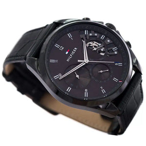 Angled shot highlighting the black croc-embossed leather strap of Tommy Hilfiger 1710452