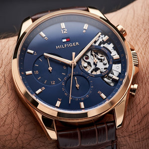 Side profile of the polished rose gold-tone case and textured crown on the Tommy Hilfiger 1710453