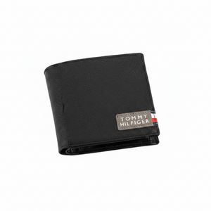 High-detail close-up of the signature fabric logo patch and Saffiano leather texture on a Tommy Hilfiger black men's wallet