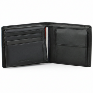 Interior view of the Tommy Hilfiger black leather wallet showing organized card slots, a secure buttoned coin pocket, and the "Genuine Leather" stamp