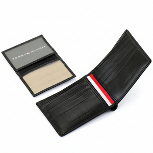 Tommy Hilfiger men's black leather bifold wallet set showing the main wallet and its matching removable card holder with a clear ID window