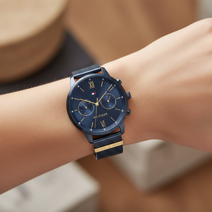 Close up of navy sunray dial with gold accents and crystal-set bezel of Tommy Hilfiger 1782305