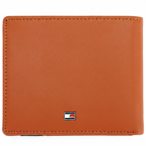 Rear perspective of the Tommy Hilfiger camel leather wallet showing the clean finish and a small silver-toned enamel flag logo