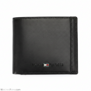 Detailed close-up of the interior of a Tommy Hilfiger black wallet featuring the "Genuine Leather" embossed stamp and neat card slots