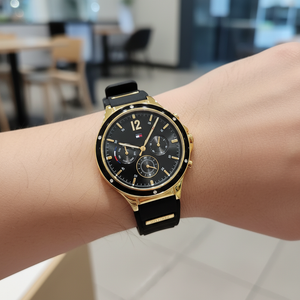 Close up of black sunray dial with crystal markers and gold accents of Tommy Hilfiger 1782282