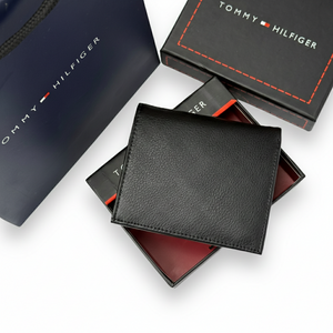 Back view of Tommy Hilfiger men's bifold wallet showing sleek black leather finish