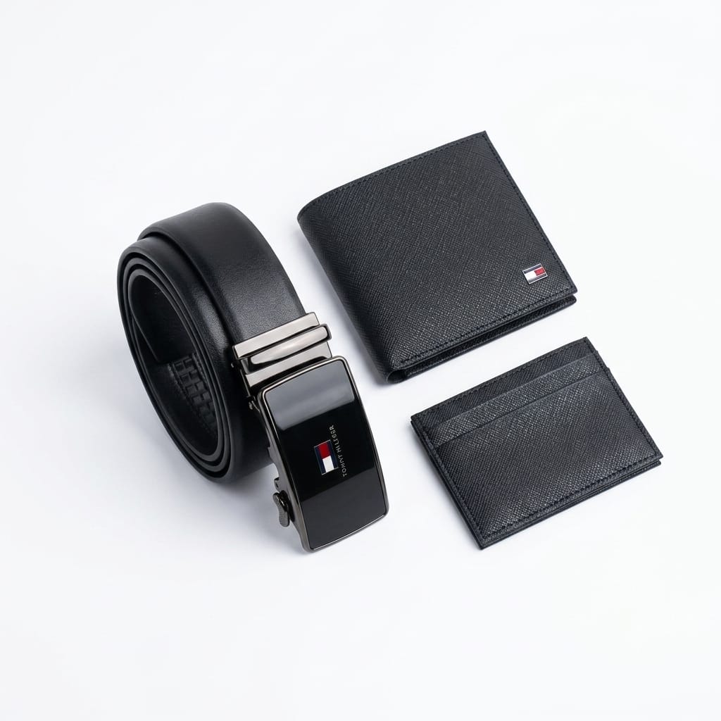 Close-up product photography of the Tommy Hilfiger classic leather belt showcasing the polished silver buckle engraved with brand text over the black smooth leather strap