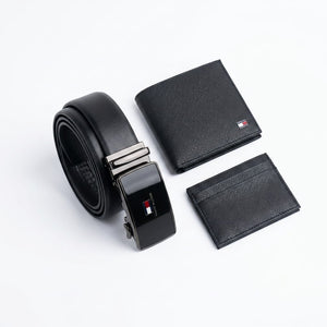 Close-up product photography of the Tommy Hilfiger classic leather belt showcasing the polished silver buckle engraved with brand text over the black smooth leather strap