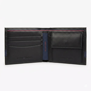 Angled studio product view of the Tommy Hilfiger mirror original detachable smooth black leather card case showcasing card slots and metal flag logo