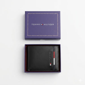 Top-down studio photograph of the Tommy Hilfiger mirror original leather wallet with card case set neatly presented inside its open signature gift box