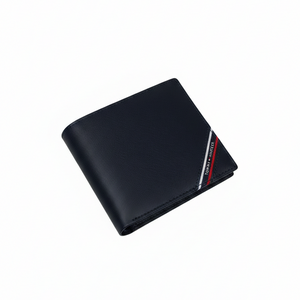 Interior view of Tommy Hilfiger navy blue leather wallet displaying card slots and the signature diagonal stripe wrapping around the bottom edge