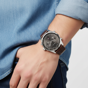 Man wearing sophisticated Tommy Hilfiger Sawyer 1710422 watch with brown leather strap