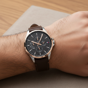 Close up of black textured dial and rose gold-tone hands of Tommy Hilfiger 1791615