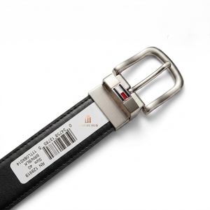 Detailed close-up of the Tommy Hilfiger polished silver pin buckle showing the iconic color flag logo