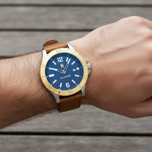 Close up of navy blue dial and gold-tone bezel of Tommy Hilfiger 1710529