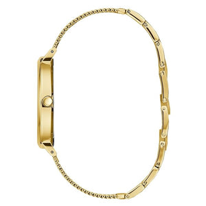 Detailed view of gold-tone minimalist crown on Guess U1155L3 women's quartz battery watch
