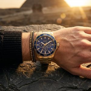 Close up of Guess Chaser W0172G5 men's quartz battery watch on wrist showing clean blue dial and luxury blue dive bezel