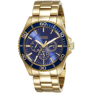 Gold watch with blue face on a white background