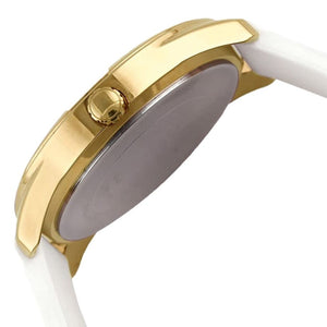 Female model wearing Guess G-Twist W0911L7 gold and white watch with a fresh summer outfit