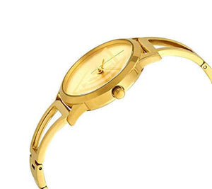 Right angled view of Guess W1145L3 women's quartz battery watch highlighting gold finish and cut-out bangle details