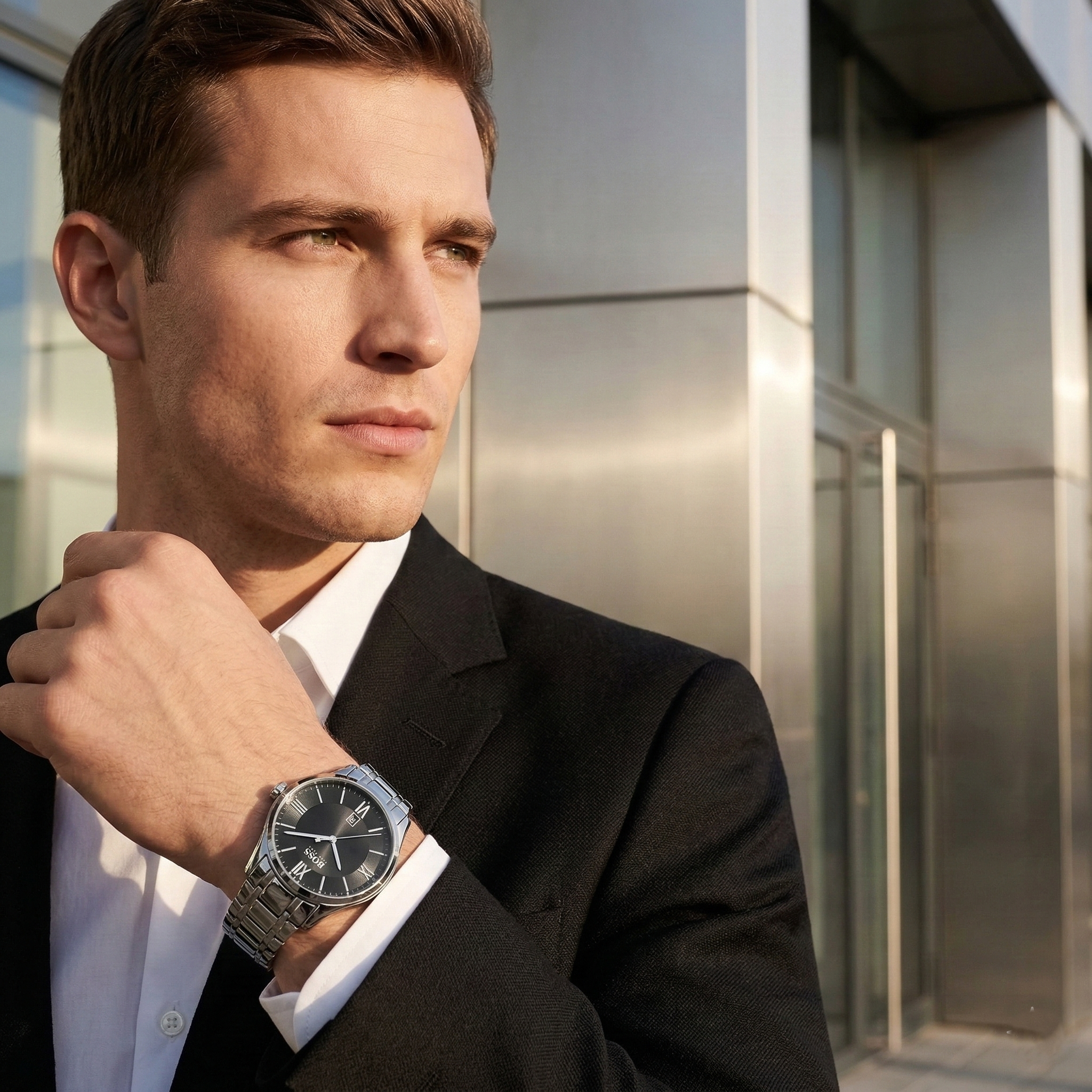 Professional man wearing Hugo Boss Ambassador 1513025 with black dial and silver metal link strap water resistant 30m